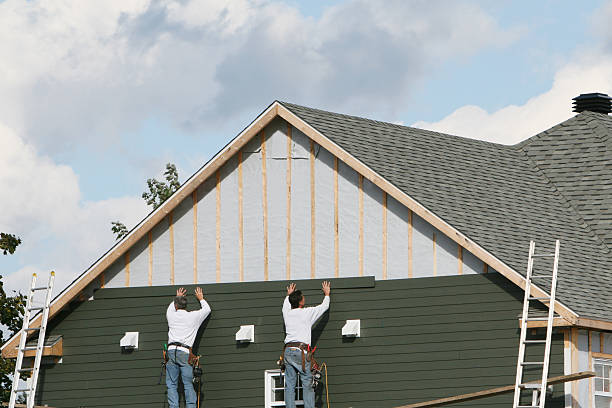 Professional Storm Damage Siding Repair technician working in Carrboro, NC